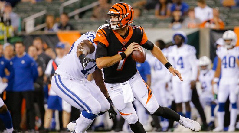 Cincinnati Bengals quarterback Jake Dolegala (7) looks to pass under pressure by Indianapolis Colts defensive tackle Caraun Reid (75) during the second half of an NFL preseason football game, Thursday, Aug. 29, 2019, in Cincinnati. (AP Photo/Frank Victores)