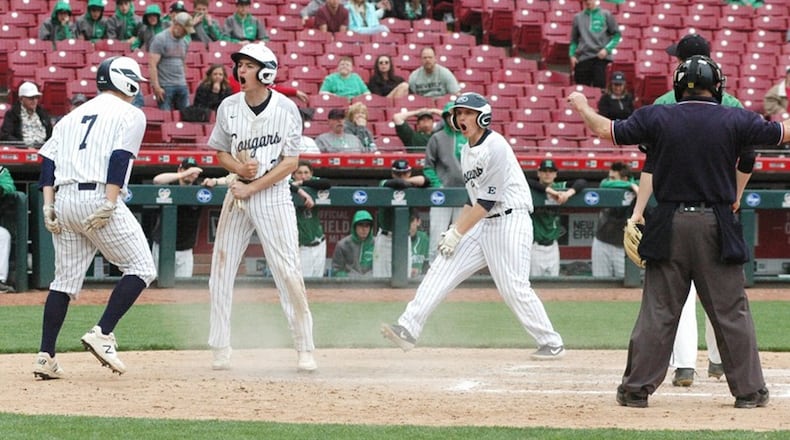 Edgewood’s Kody McCarley (7) and Bryce Davis (right) surround Mason Whiteley after he scored the winning run April 27 during a Southwest Ohio Conference baseball game against Harrison at Great American Ball Park in Cincinnati. Edgewood won 2-1 in eight innings as part of the Skyline Chili Reds Futures High School Showcase. RICK CASSANO/STAFF