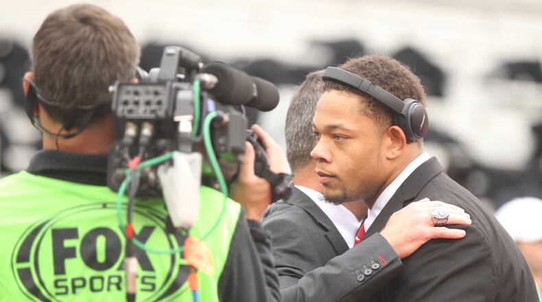 Ohio States Demetrius Knox hugs Urban Meyer after arriving at Ohio Stadium before a game against Penn State on Saturday, Oct. 28, 2017, in Columbus. David Jablonski/Staff