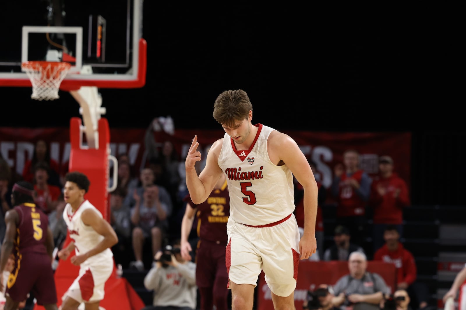 Miami’s Peter Suder celebrates after sinking a 3-pointer against Central Michigan on Tuesday night at Millett Hall. ELIJAH COOK / CONTRIBUTED