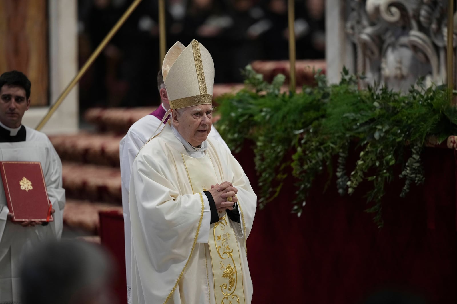 Delegate of the Holy Father, Cardinal Domenico Calcagno presides over the Chrism Mass on Ash St. Peter's Basilica at The Vatican, Thursday, April. 17, 2025. (AP Photo/Andrew Medichini)