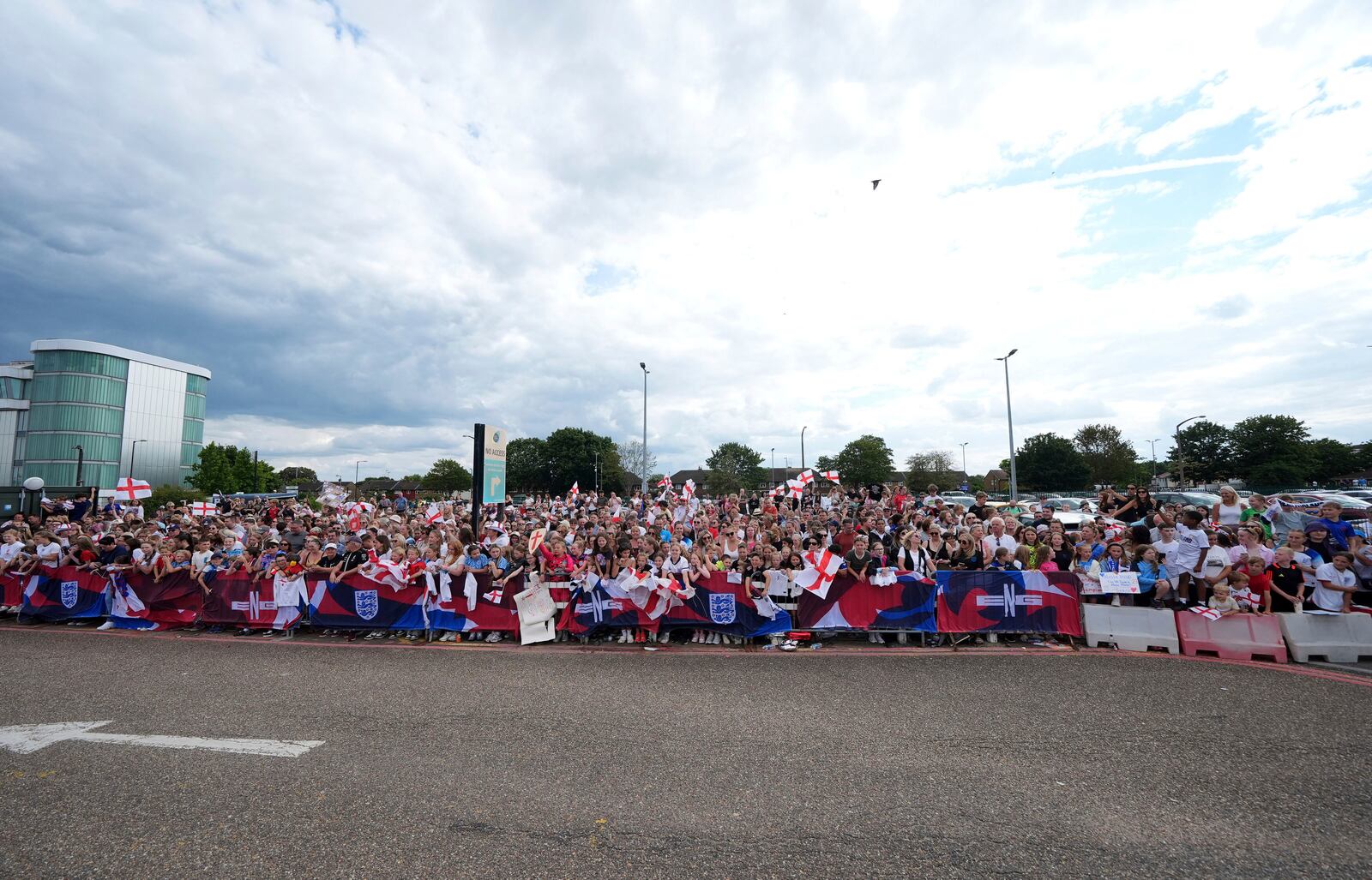England fans waiting for the England team to arrive, outside London Southend Airport in Southend, England, Monday, July 28, 2025, after they won the Women's Euro 2025 final. (Yui Mok/PA via AP)