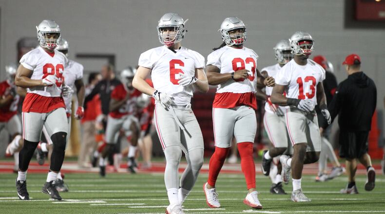Ohio State players, including Sam Hubbard (6) and Tracy Sprinkle (93), practice on Tuesday, March 6, 2017, at the Woody Hayes Athletic Center in Columbus. David Jablonski/Staff