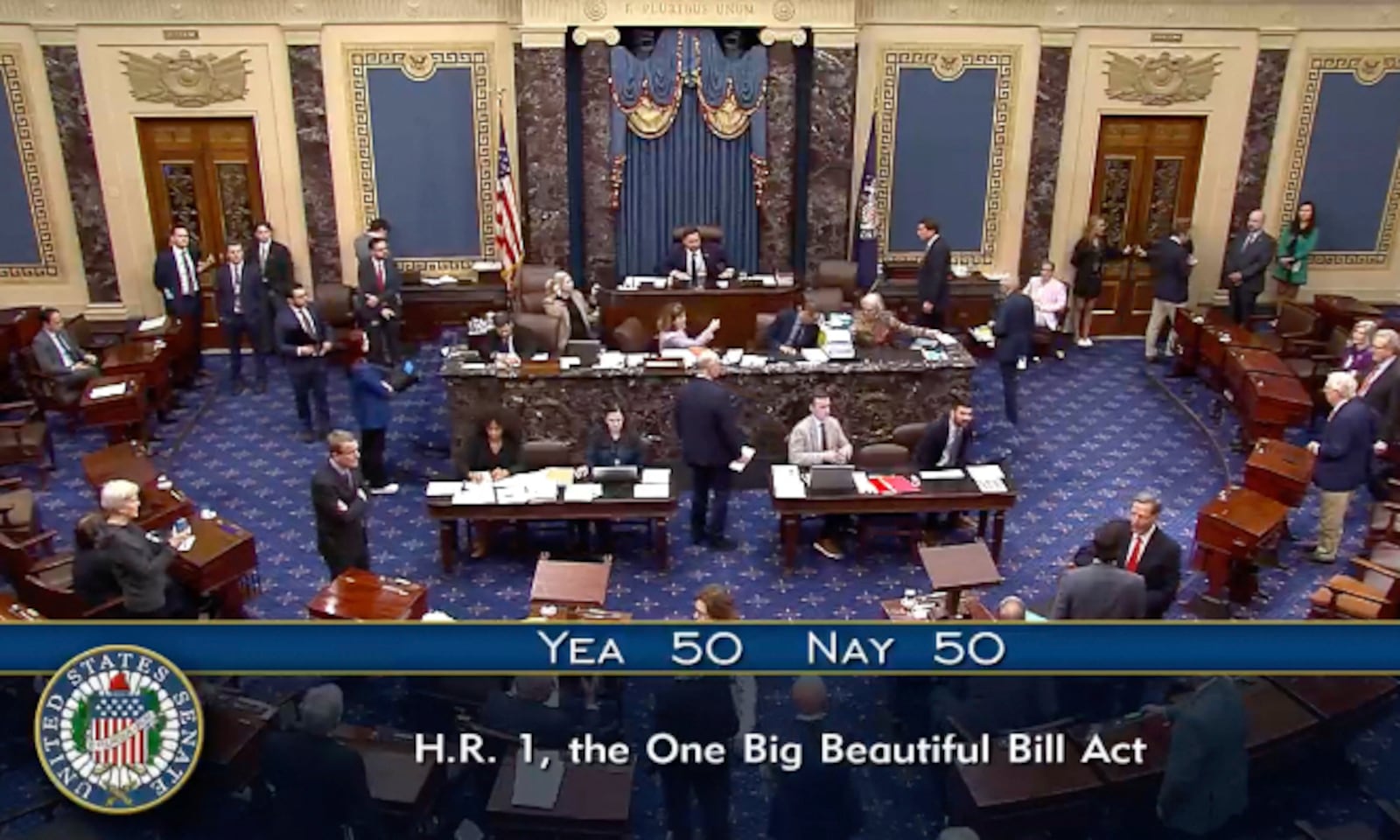 In this image from video from Senate Television, Vice President JD Vance, seated center, breaks a 50-50 tie to push President Donald Trump’s big tax breaks and spending cuts bill over the top, on the Senate floor at the U.S. Capitol, Tuesday, July 1, 2025, in Washington. (Senate Television via AP)