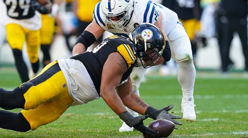 Pittsburgh Steelers defensive tackle Derrick Harmon (99) recovers a fumble in front of Indianapolis Colts guard Quenton Nelson (56) during the second half of an NFL football game in Pittsburgh, Sunday, Nov. 2, 2025. (AP Photo/Matt Freed)