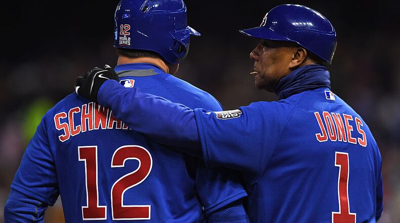 CLEVELAND, OH - OCTOBER 26: Kyle Schwarber #12 of the Chicago Cubs talks with third base coach Gary Jones #1 against the Cleveland Indians in Game Two of the 2016 World Series at Progressive Field on October 26, 2016 in Cleveland, Ohio. (Photo by Jason Miller/Getty Images)