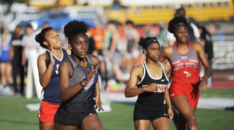 Lakota East sophomore Serena Clark (near left) bested a 100 meters record that had stood since 1990 with an 11.79 in qualifying during the first day of the D-I regional track and field meet at Wayne High School in Huber Heights on Wed., May 23, 2018. MARC PENDLETON / STAFF
