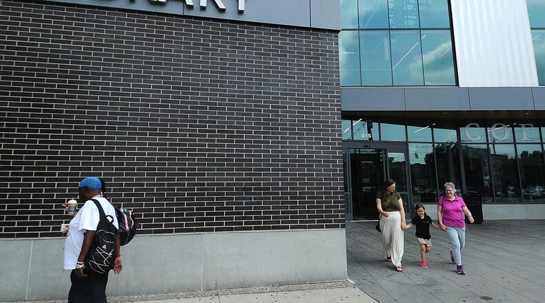 Lots of visitors coming and going Wednesday, May 22, 2024, at Dayton Metro Library’s main branch. MARSHALL GORBY\STAFF