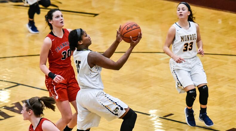 Monroe’s Olivia Wells-Daniels drives to the hoop for a basket during a Division II sectional final against Franklin on Feb. 26 at Lebanon. NICK GRAHAM/STAFF