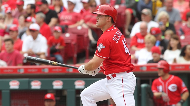 The Reds Scott Schebler swings against the Rockies on Sunday, May 21, 2017, at Great American Ball Park in Cincinnati. David Jablonski/Staff