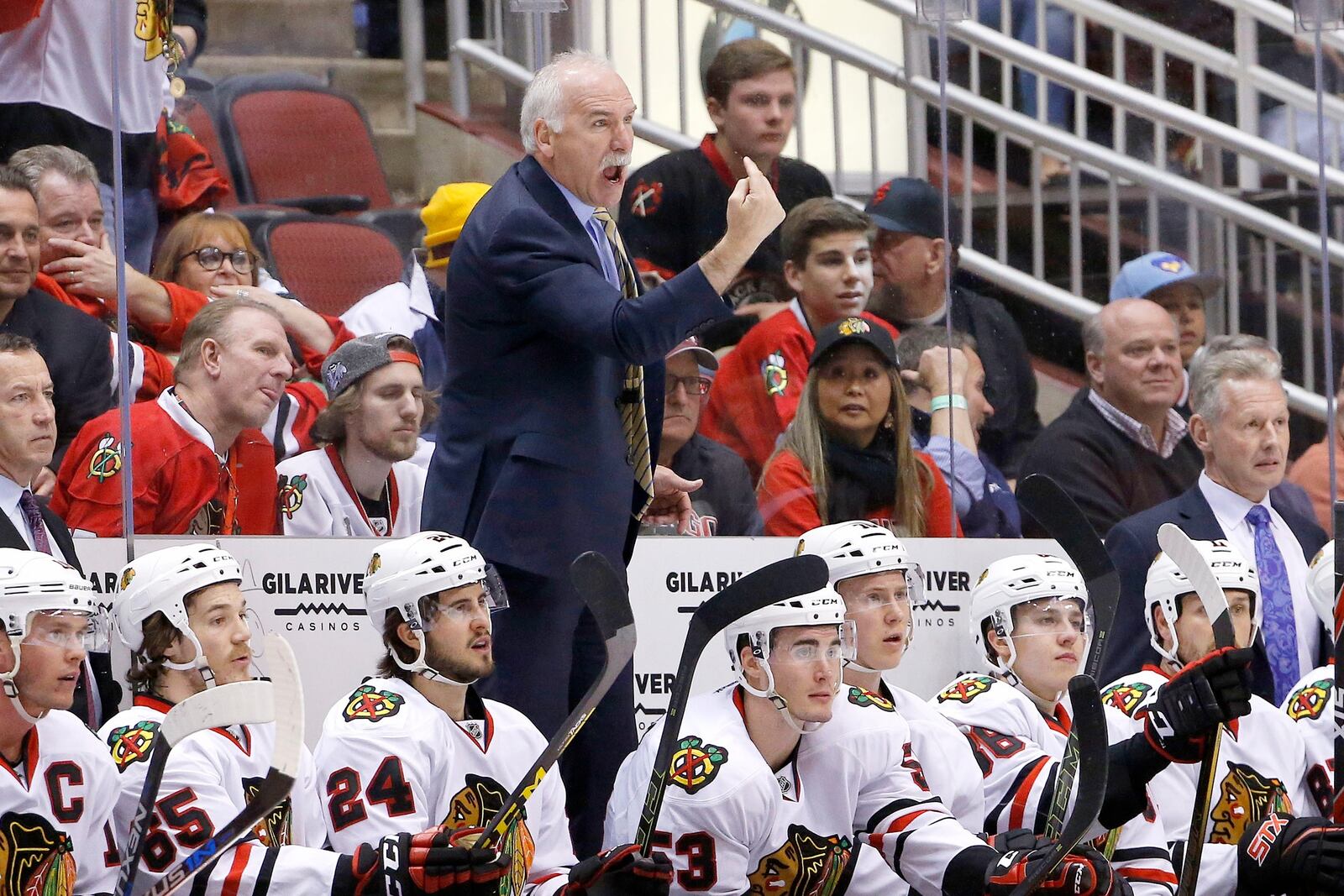 FILE - Chicago Blackhawks' Joel Quenneville stands on the team bench as he argues with officials during the first period of an NHL hockey game against the Arizona Coyotes Thursday, Feb. 4, 2016, in Glendale, Ariz. (AP Photo/Ross D. Franklin, File)