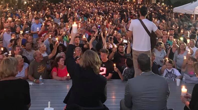A candlelight vigil was held in Dayton's Oregon District on Aug. 4, 2019. Earlier that morning a gunman killed nine people and caused 30 others to be injured. Dayton police killed a man they identified as the gunman.