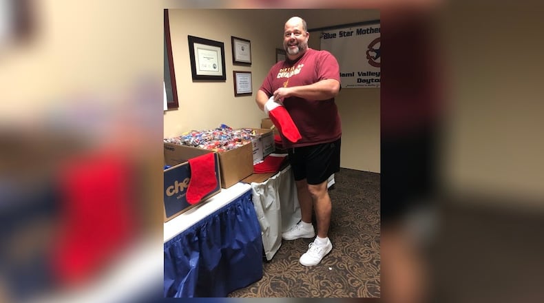 Talawanda Middle School social studies teacher John Brinck helped the Blue Star Mothers stuff ten Christmas stockings for military personnel stationed overseas as part of the 65 they sent to an Apache Helicopter Unit in Afghanistan. He included a letter from TMS students in each of the stockings. In all, the organization sent out 865 stockings. CONTRIBUTED