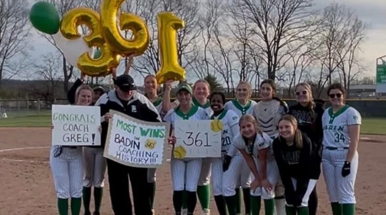 The Badin High School softball team celebrates with their coach Greg Stitzel after he earned his 361st coaching victory at the Ram helm. He became the school's winningest coach. CONTRIBUTED