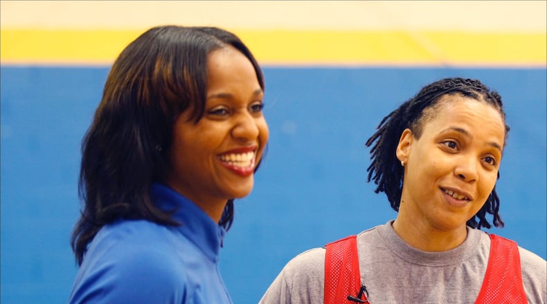 Former professional and local basketball stars Tamika Williams, left, and Rhonda Price will be playing in a Cancer Awareness Basketball Game in Dayton. TY GREENLEES / STAFF