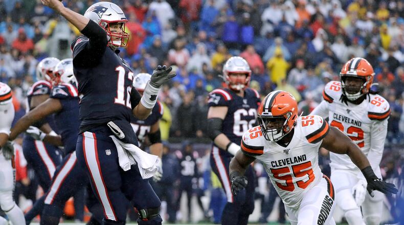 New England Patriots quarterback Tom Brady passes under pressure from Cleveland Browns linebacker Genard Avery (55) in the first half of an NFL football game, Sunday, Oct. 27, 2019, in Foxborough, Mass. (AP Photo/Steven Senne)