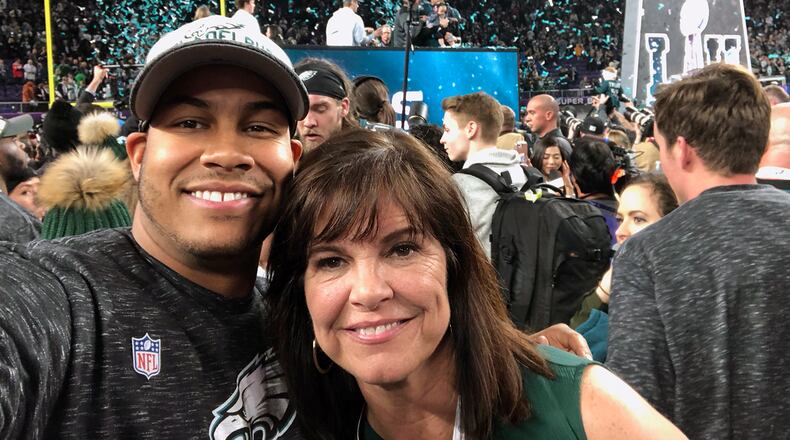 Lakota West graduate and Philadelphia Eagles linebacker Jordan Hicks poses with his mom, Kelly Justice, on the field at U.S. Bank Stadium after winning Super Bowl LII on Sunday. SUBMITTED PHOTO