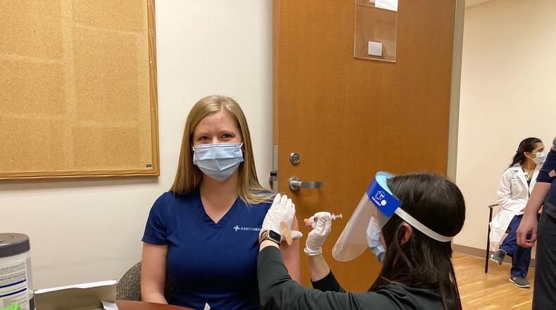 Mercy Health-Fairfield Hospital nurse Julie Rose, a COVID-floor nurse, receives the Moderna COVID-19 vaccine shot on Wednesday, Dec. 23, 2020. Mercy Health received its vaccine allotment on Wednesday, Dec. 23, 2020. PROVIDE/MERCY HEALTH