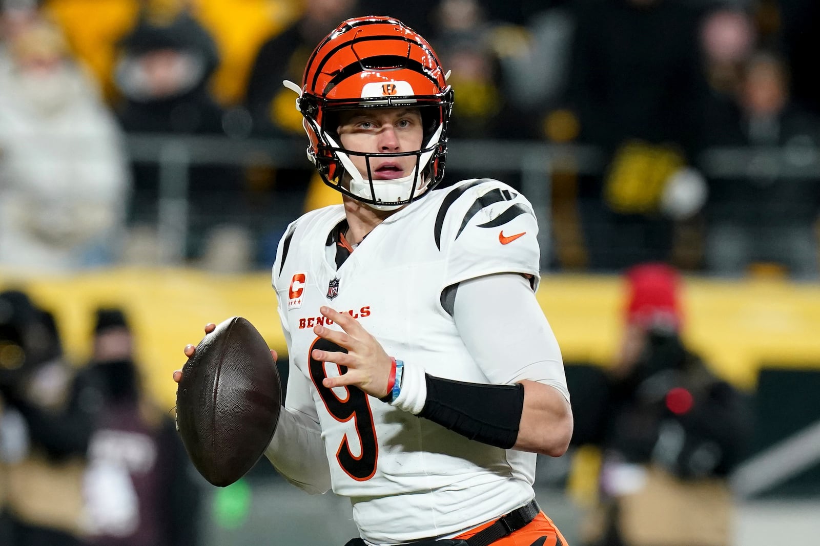 Cincinnati Bengals quarterback Joe Burrow (9) looks to throw during the first half of an NFL football game against the Pittsburgh Steelers Saturday, Jan. 4, 2025, in Pittsburgh. (AP Photo/Matt Freed)