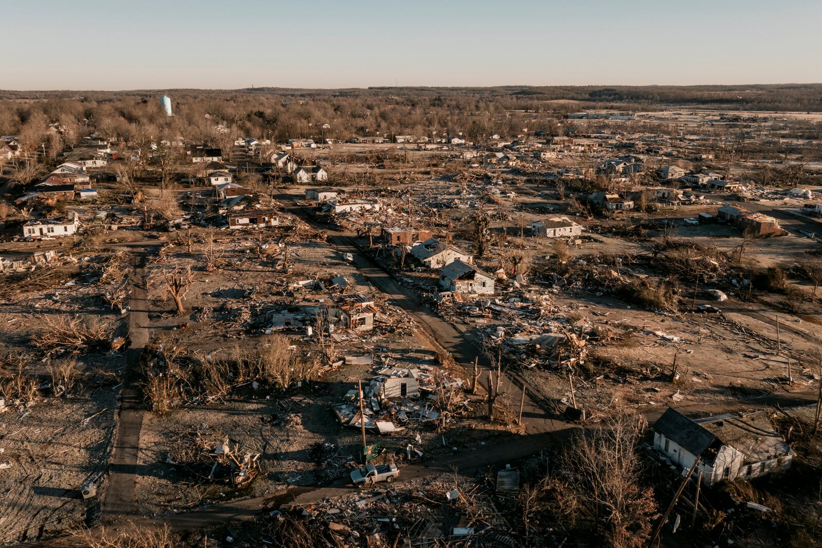 A heavily damaged neighborhood in Dawson Springs, Ky., on Monday, Dec. 13, 2021, where a tornado flattened much of the town on Friday night. After grimly fluctuating death tolls since Friday’s devastating swarm of tornadoes, Gov. Andy Beshear of Kentucky said on Monday that there were 64 confirmed deaths in the state, though he expected that number to rise as crews continued to search through the ruins. (William Widmer/The New York Times)