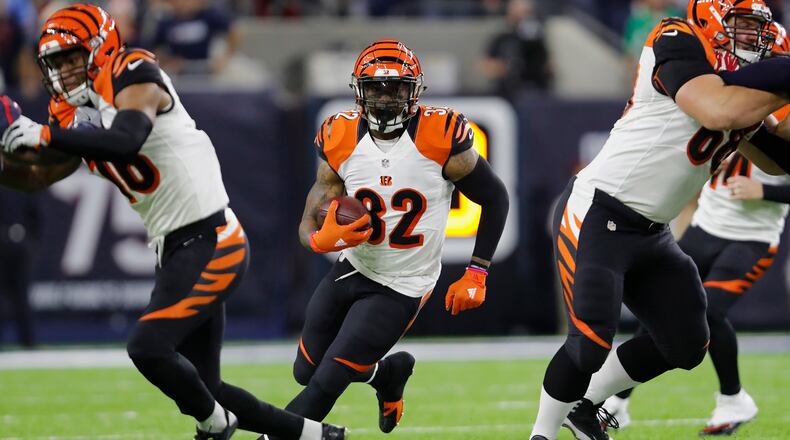 Bengals running back Jeremy Hill , seen here last season, was the man, or one of them, at Tuesday's training camp practice as he gathered teammates together for an impromptu social media photo. He sure doesn't look like there's any bad blood between the running backs and linebackers, even after Vontaze Burfict went low on Giovanni Bernard and upset Cincy coaches.