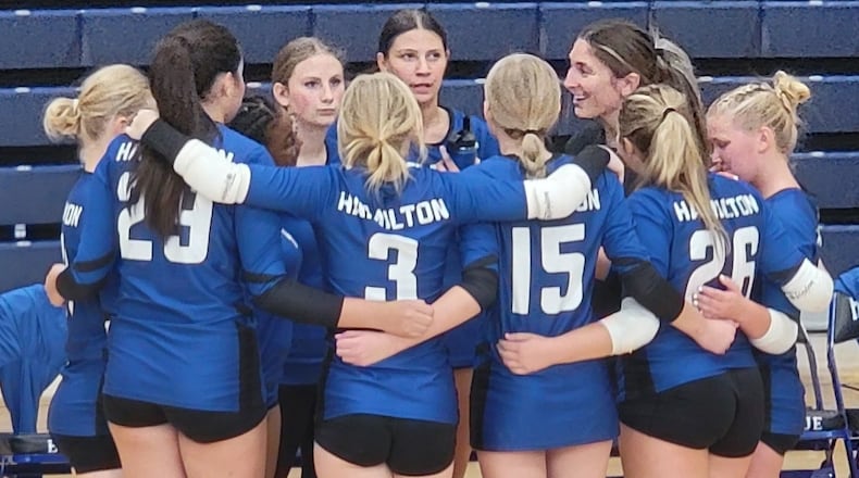 Veda Morrison chats with her Hamilton freshman volleyball team during a timeout last season. CONTRIBUTED PHOTO