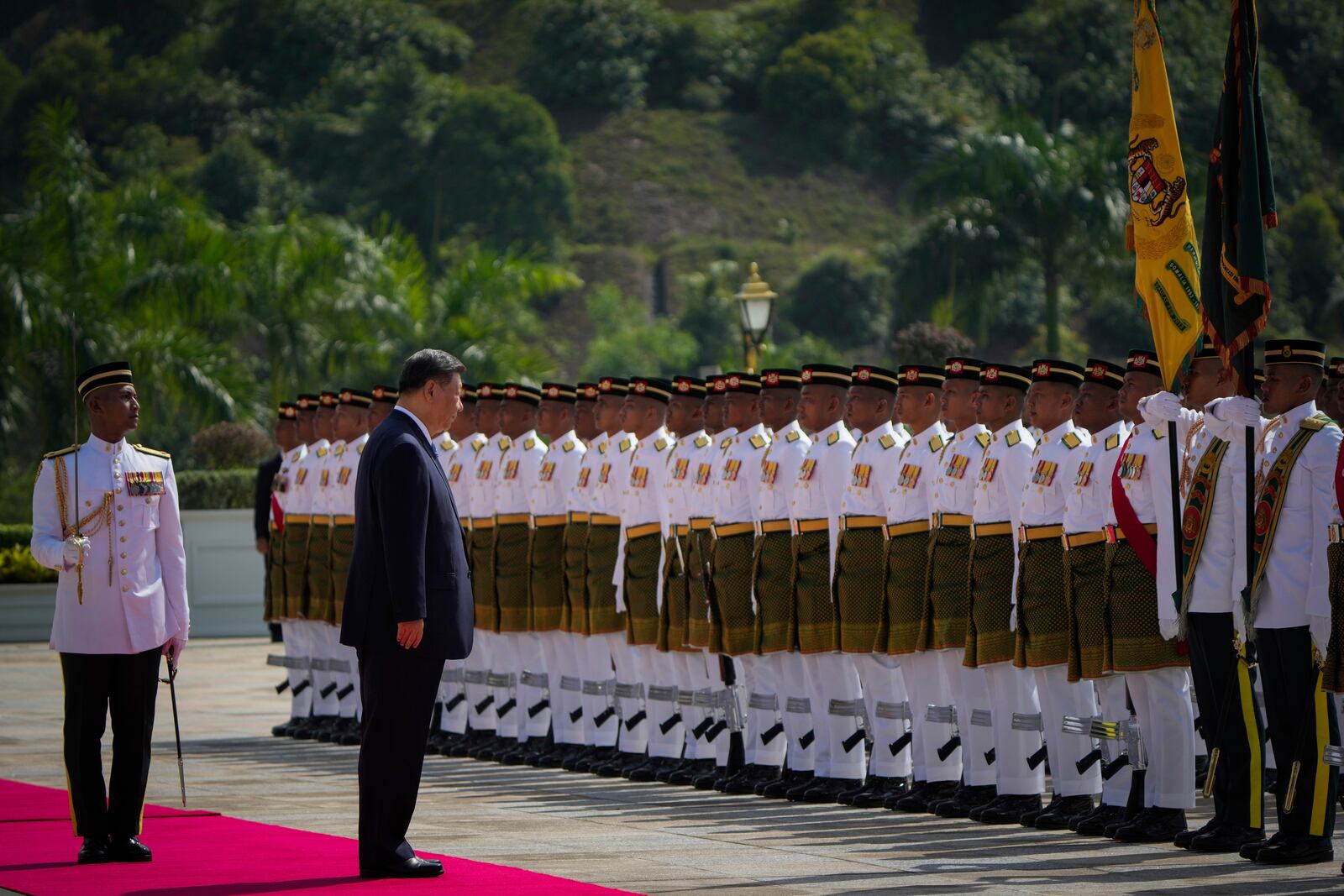 Chinese President Xi Jinping inspects honor guards during the official welcoming ceremony at the national palace in Kuala Lumpur, Malaysia, Wednesday, April 16, 2025. (AP Photo/Vincent Thian, Pool)