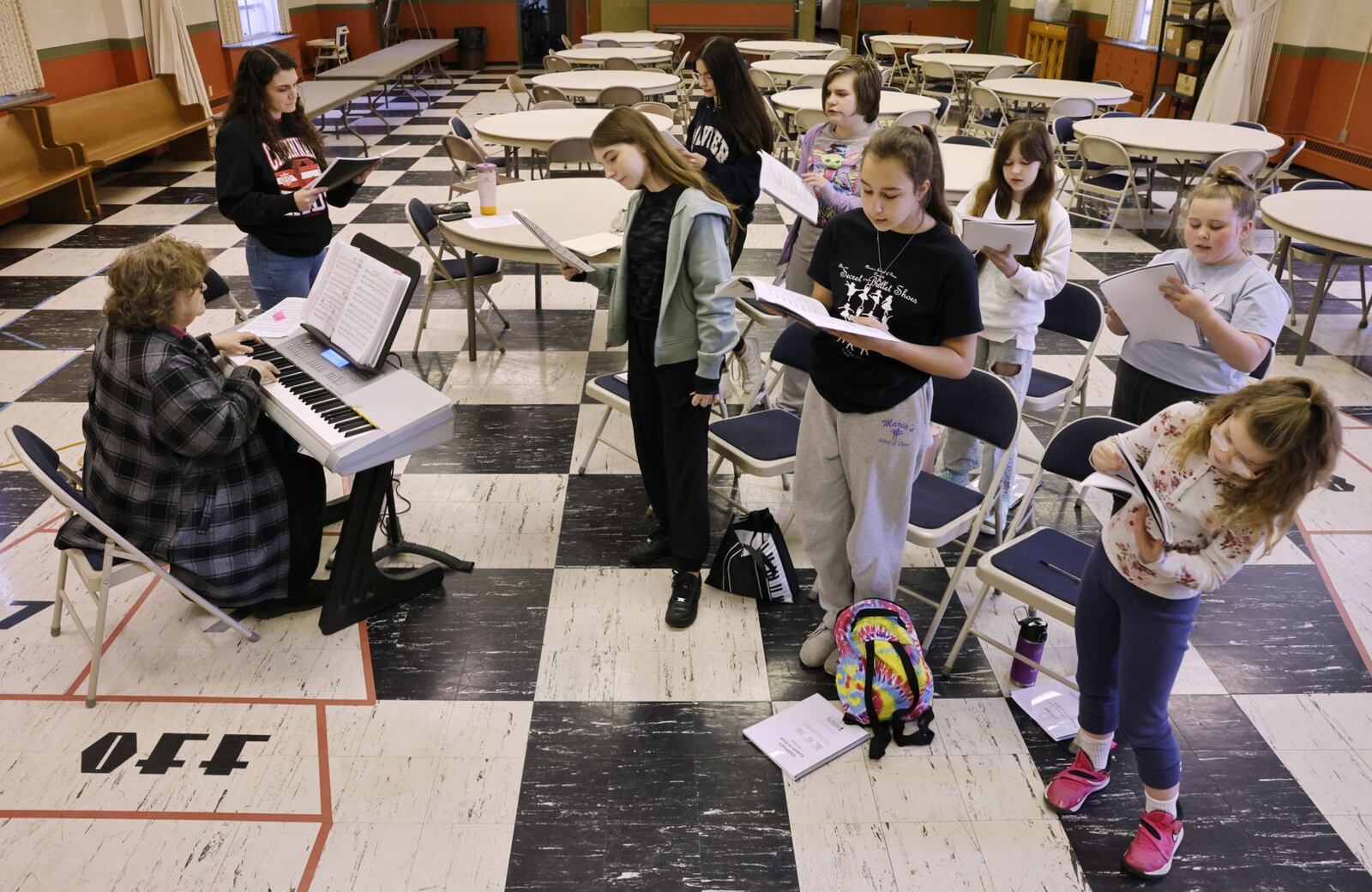 Music director Mary Ellen Clinard on keyboard and Asst. Director Abbie Miller help youth learn the music for the upcoming production of "Letters to God" Saturday, April  12, 2025 in Middletown. The Middletown Lyric Theatre is back and partnering with Sorg Opera House for this production. NICK GRAHAM/STAFF