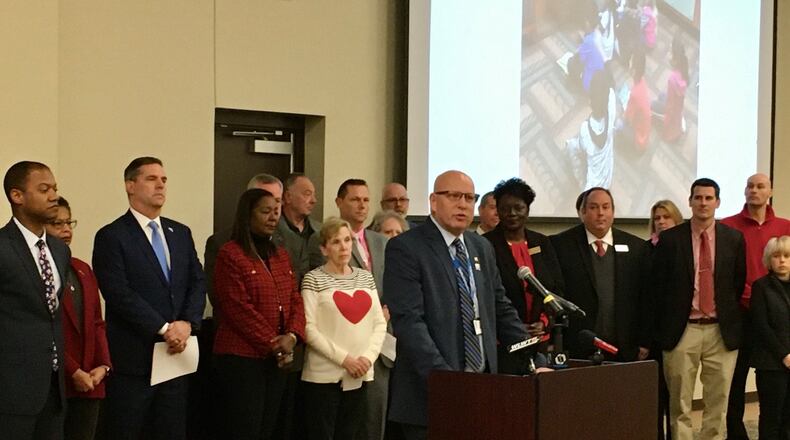 Hamilton Schools Superintendent Mike Holbrook was one of the main speakers at a joint press conference Friday where school officials from some public school districts in Butler, Warren and Hamilton counties blasted the recently expanded EdChoice private school voucher program. But private school officials say their school families also pay local public school taxes and receiving a portion of tax monies for the vouchers is fair. (Photo By Michael D. Clark/Journal-News)