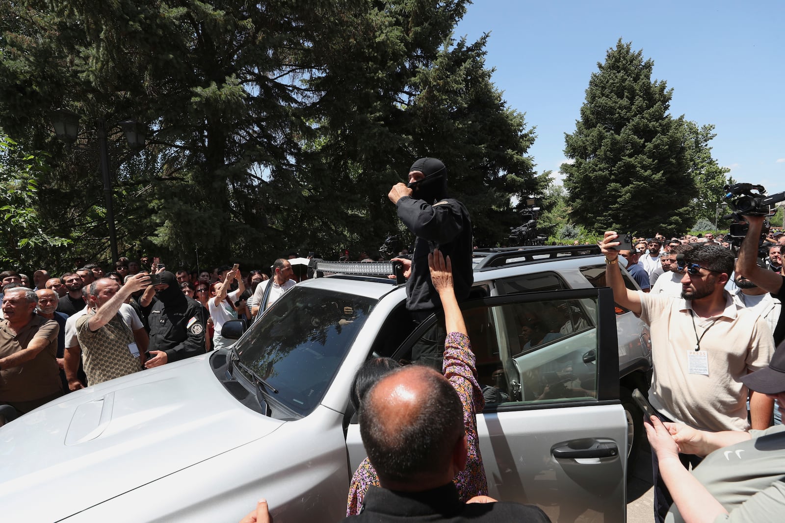 Armenian National Security Service officers arrive to arrest Mikael Ajapahyan, Archbishop of Gyumri and Shirak, at Echmiadzin, the seat of the Armenian Apostolic Church outside Yerevan, Armenia, Friday, June 27, 2025. (Hayk Baghdasaryan/Photolure via AP)