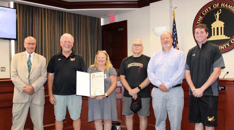 Hamilton Mayor Pat Moeller (left) poses with Hamilton Joes staff during honorary recognition at August 10 council meeting. PEARL ZAJBEL/CONTRIBUTED