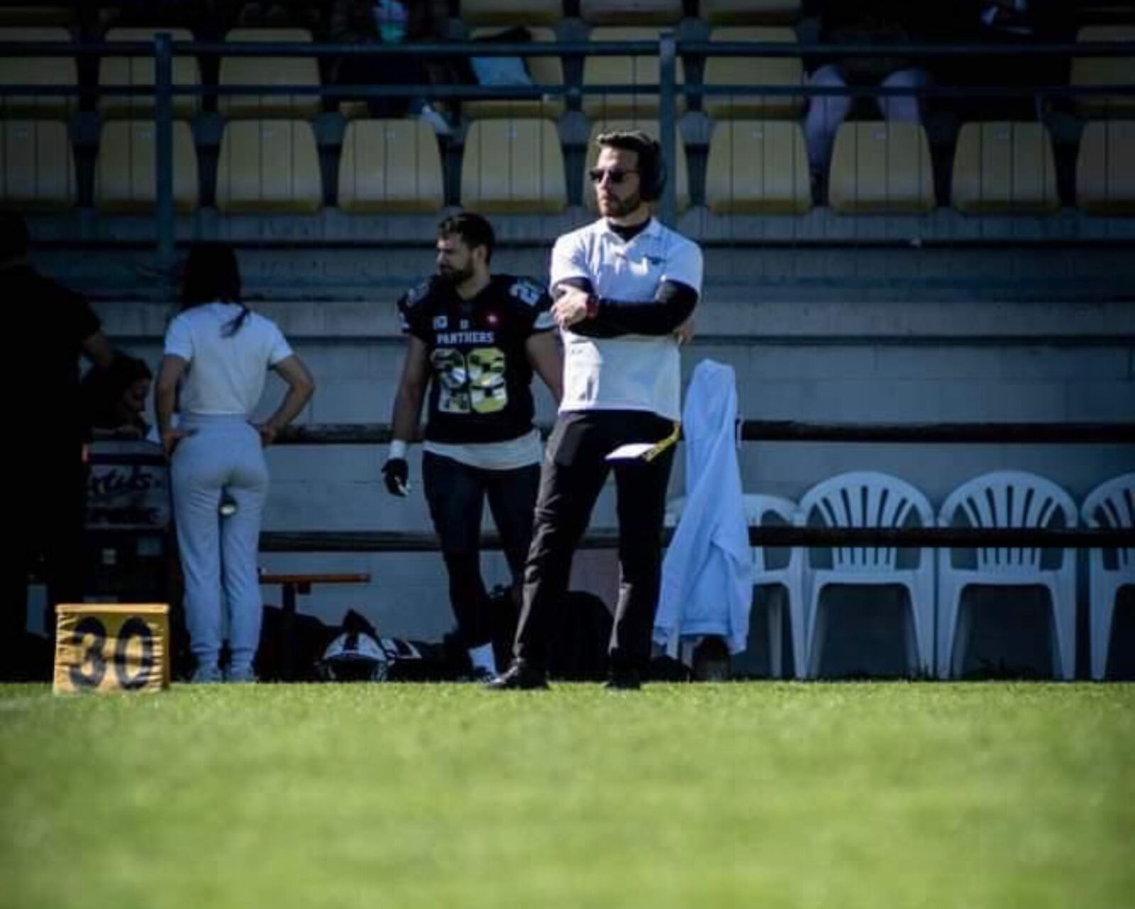 Fairfield High School grad Brian Michitti (center) is the coach of the Parma Panthers, an American football team based in Parma, Itlay. CONTRIBUTED