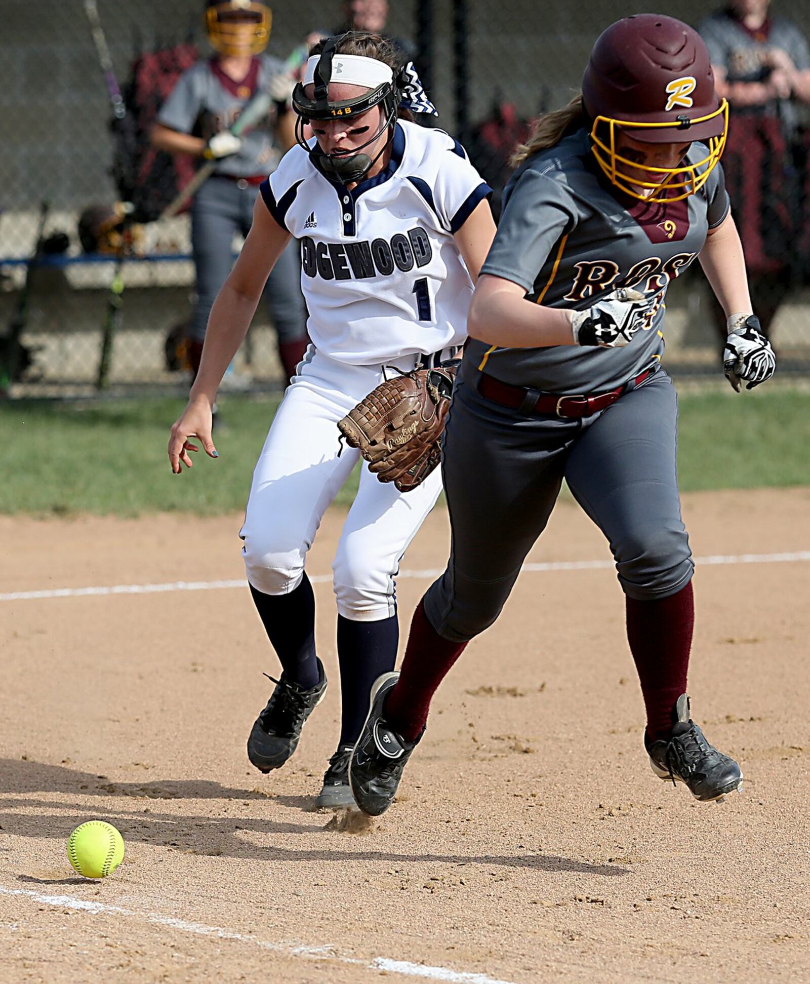 Edgewood third baseman Rebekah Schiavone chases a bunt as Adrienne Gleason of Ross runs safely to first during their game in Trenton on Friday. CONTRIBUTED PHOTO BY E.L. HUBBARD