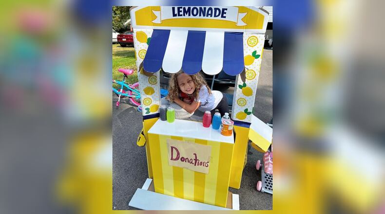 Pamela’s daughter Jasmine brings back the magic of a ’90s summer with her old-school lemonade stand. PAMELA CHANDLER/CONTRIBUTED