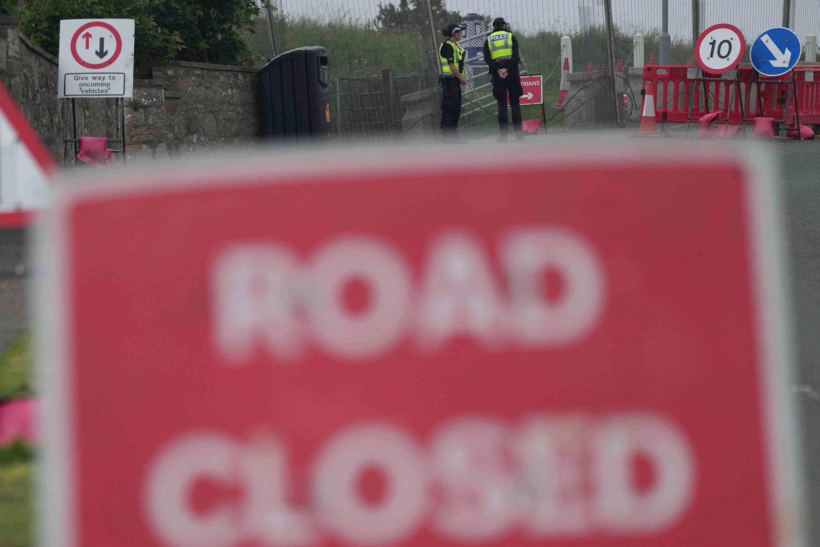 Police officers stand at a checkpoint near the Trump Turnberry golf course in Turnberry, Scotland, Wednesday, July 23, 2025, ahead of President Trump's expected visit Scotland later this week. (AP Photo/Alastair Grant)