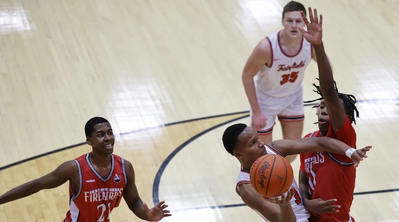 Fairfield's Kollin Tolbert goes to the hoop defended by Lakota West's Jason Lavender during their basketball game Friday, Jan. 14, 2022 at Fairfield High School. NICK GRAHAM / STAFF