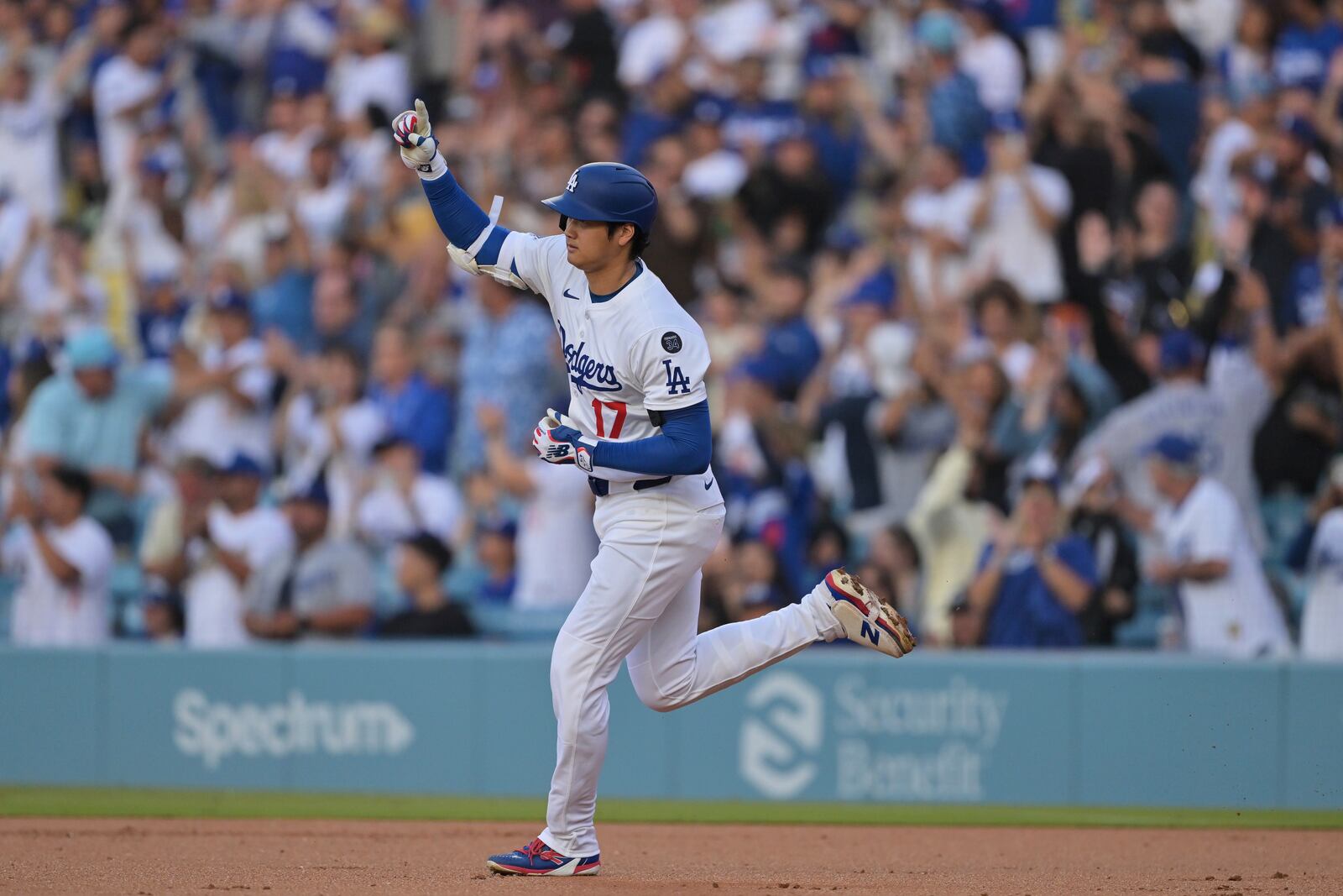 Los Angeles Dodgers pitcher Shohei Ohtani gestures after hitting a two-run home run during the first inning of a baseball game against the Minnesota Twins in Los Angeles, Monday, July 21, 2025. (AP Photo/Jayne Kamin-Oncea)