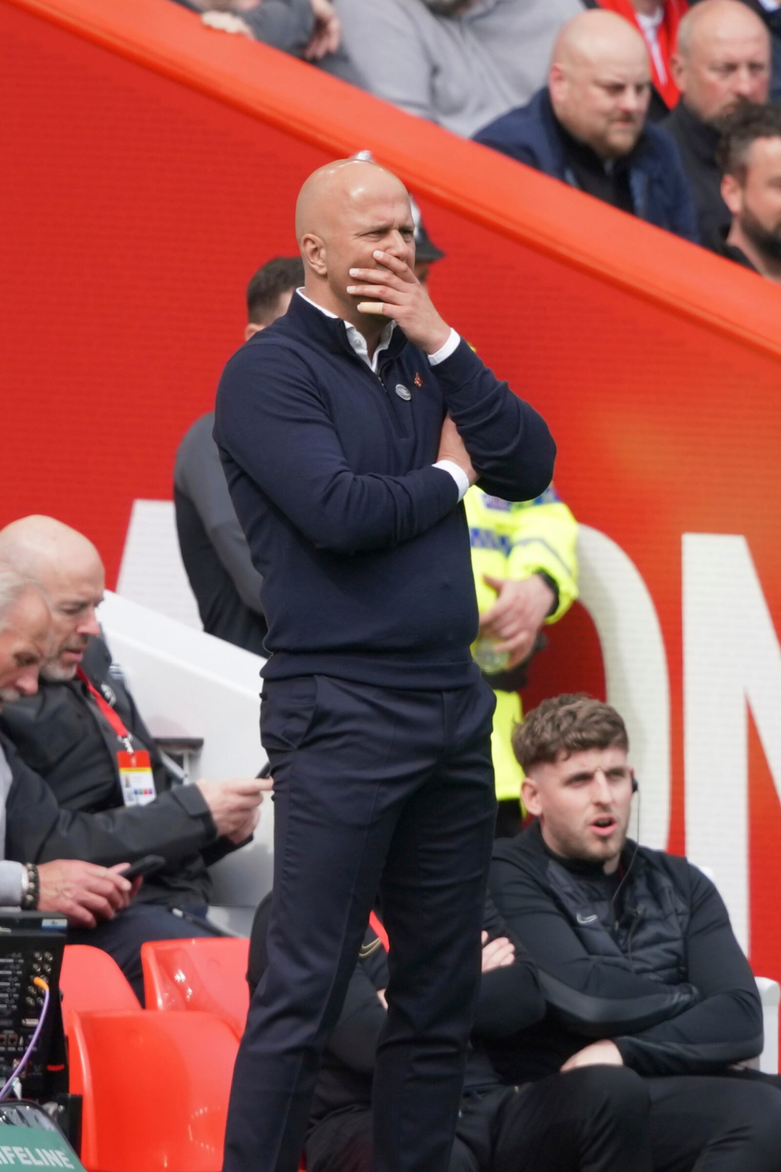 Liverpool's manager Arne Slot follows the game during the English Premier League soccer match between Liverpool and West Ham United at Anfield in Liverpool, Sunday, April 13, 2025. (AP Photo/Ian Hodgson)