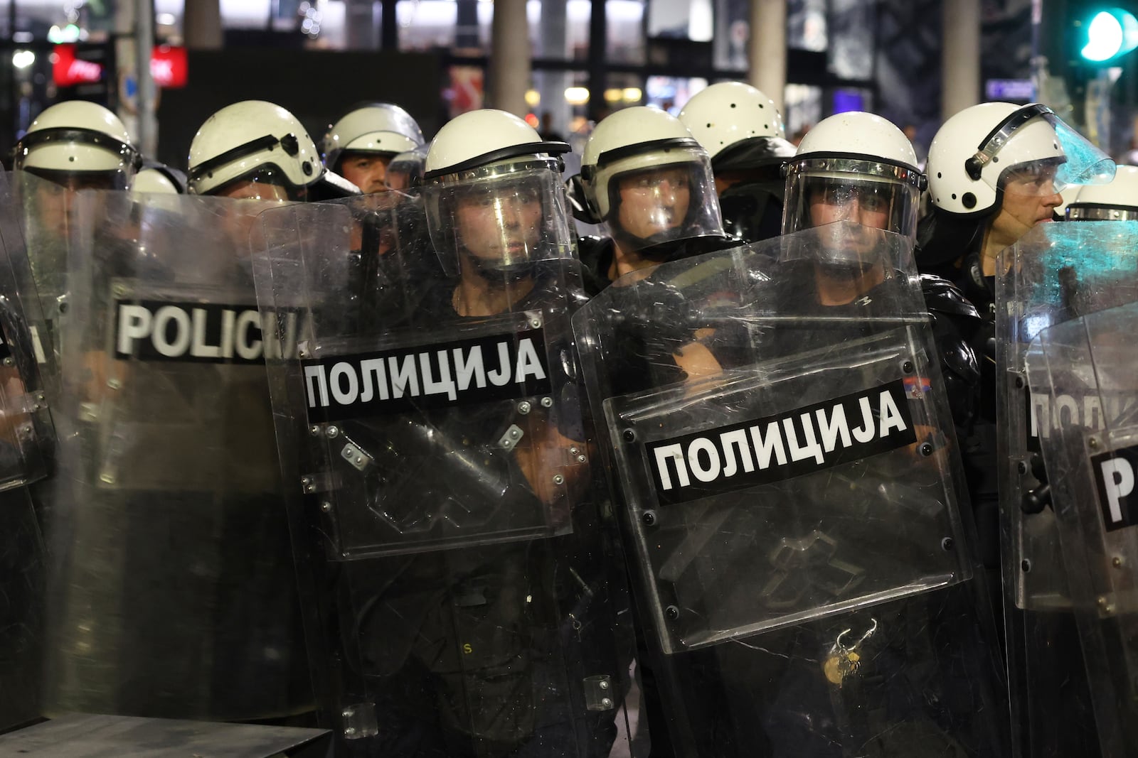 Riot police take positions on a street during a major anti-government rally pressing for an early election after nearly eight months of almost daily anti-corruption demonstrations that have shaken the populist government of President Aleksandar Vucic, in Belgrade, Serbia, Saturday, June 28, 2025. (AP Photo/Marko Drobnjakovic)