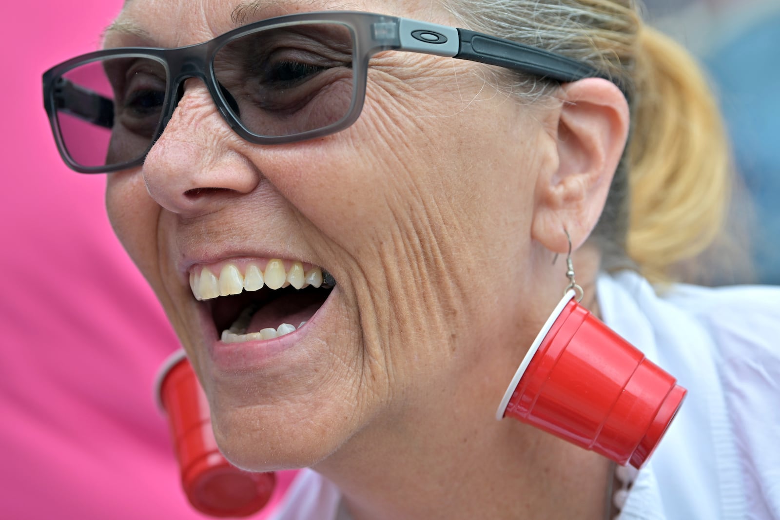 Karen Read supporter Bonnie Fitzgibbon of Chelmsford, MA, wears earrings mocking the investigation into the death of John O'Keefe outside the courthouse on the third day of jury deliberations in Read's trial at Norfolk Superior Court, Wednesday, June 18, 2025, in Dedham, Mass. (AP Photo/Josh Reynolds)