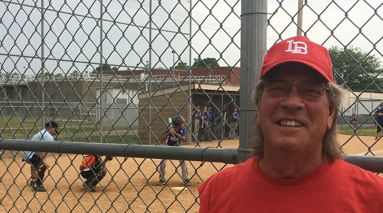 Virgil Cook, a resident of Hamilton’s Lindenwald neighborhood, has been coaching baseball and softball for 25 years. He said he watches games five or six days each week through the spring and summer seasons. MIKE RUTLEDGE/STAFF