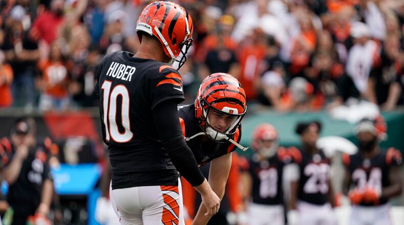 Cincinnati Bengals placekicker Evan McPherson, right, reacts after missing a field goal out of the hold of punter Kevin Huber (10) during overtime of an NFL football game against the Pittsburgh Steelers, Sunday, Sept. 11, 2022, in Cincinnati. (AP Photo/Joshua A. Bickel)