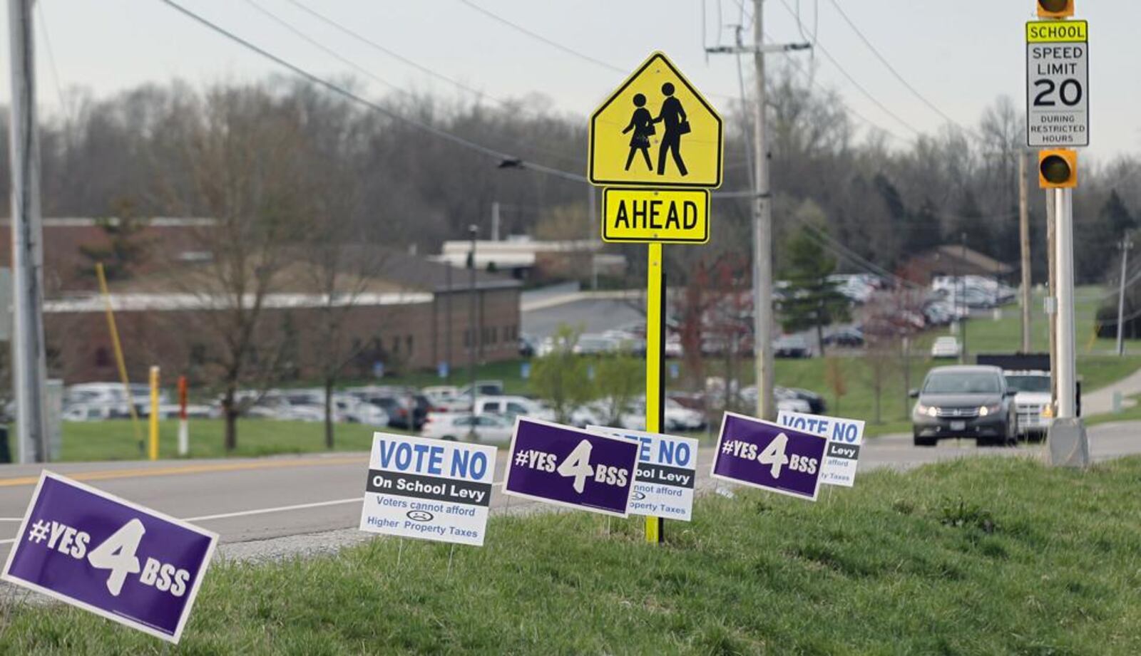 Political signs dotted the sides of roadways in the Bellbrook-Sugarcreek school district in May 2019. TY GREENLEES/STAFF