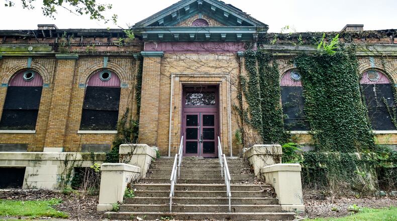 Middletown City Council will consider a city Historic Commission recommendation to designate the the Carnegie Library site, 1320 First St., as a historic site and recommend the site to the National Register of Historic Places of the U.S. Department of the Interior. FILE PHOTO Background: An application for local landmark status was submitted to the Middletown Historic Commission by property owner Dan Mayzum (1865 GEBA LLC) for the Carnegie Library located at 1320 First Avenue, Middletown, Ohio 45044. The Carnegie Library site includes three properties: Parcel Q6532001000014, Parcel Q6532001000015, and Parcel Q6532001000016. A public hearing was held on June 20, 2019 in accordance with Chapter 1212: Historic Preservation of the Middletown Development Code. The Historic Commission voted in favor and recommend approval of the designation. The Historic Commission’s recommendation of approval is being forwarded to the Middletown City Council for their public hearing for the historic designation at the August 6, 2019 meeting. The Historic Commission based their recommendation on the site meeting all of the review criteria for a historic designation outlined in the Middletown Development Code. Dan Mayzum, a historic preservation architect, recently purchased the old Carnegie Library at the corner of First Avenue and Curtis Street in Middletown. Construction started in 1911 and the building had several additions through the years. Mayzum wants to turn the building into a home brewers brewery, a restaurant, a reception and banquet room and a cooperative workspace and marketing research facility. NICK GRAHAM/STAFF