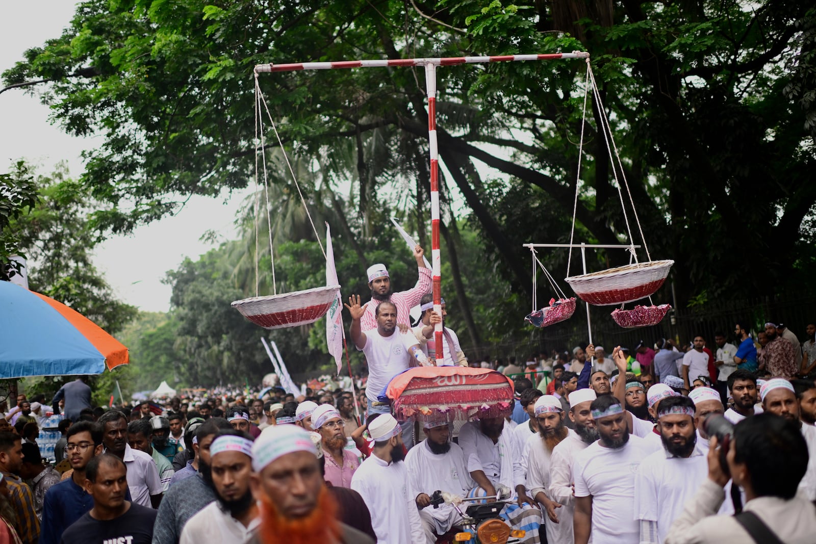Thousands of supporters of Bangladesh's largest Islamist party Jamaat-e-Islami turn out at a rally in a show of strength ahead of elections expected next year, in Dhaka, Bangladesh, Saturday, July 19, 2025. (AP Photo/Mahmud Hossain Opu)