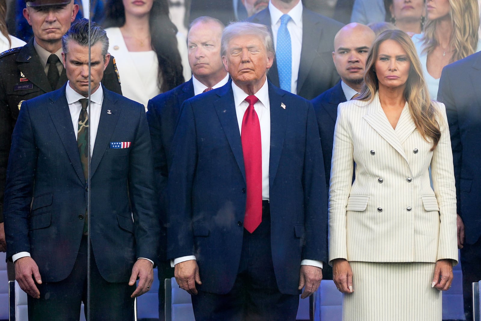 President Donald Trump, first lady Melania Trump and Defense Secretary Pete Hegseth attend a military parade commemorating the Army's 250th anniversary, coinciding with his 79th birthday, Saturday, June 14, 2025, in Washington. (AP Photo/Julia Demaree Nikhinson)