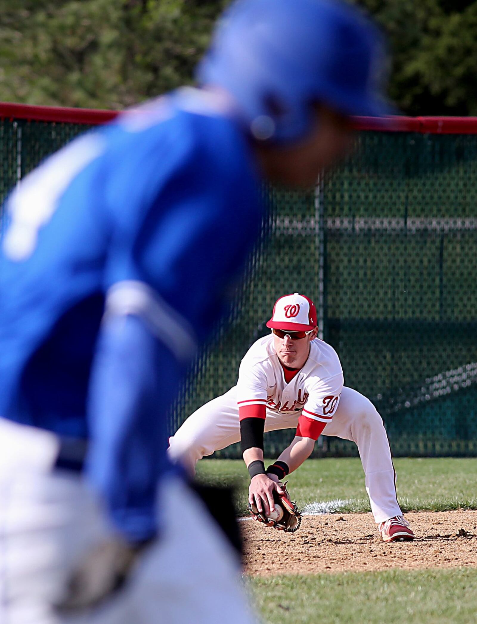 Lakota West third baseman Michael Medley makes a third-inning play and gets Hamilton’s Sebastien Stamper at first during Sunday’s game at West. CONTRIBUTED PHOTO BY E.L. HUBBARD