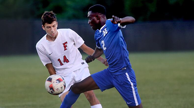 Fairfield midfielder Evan Van Rheenen battles with Hamilton forward Alvin Mantey during their game at Christy Rose Dennis Memorial Stadium in Fairfield on Oct. 4, 2016. CONTRIBUTED PHOTO BY E.L. HUBBARD