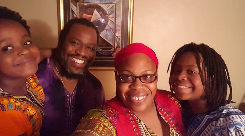 Lucy "Sierra Leone" and Robert Owens with their sons Nesta and Winston. The family celebrates Kwanzaa.
