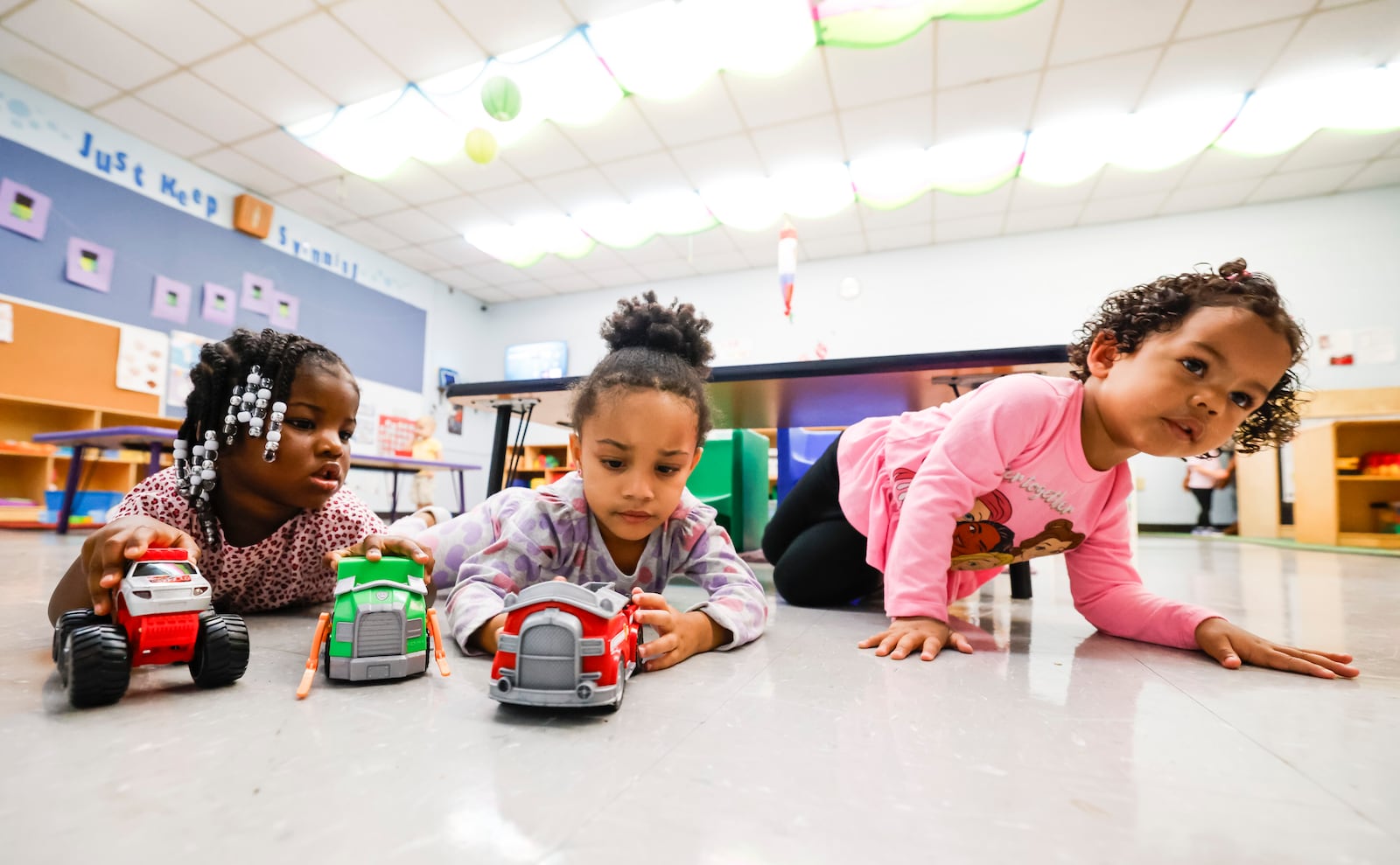 Kae'mony Jackson, left, Kenzley Mitchell, mddle, and Aalani Gates play with trucks their classroom in the Early Childhood Learning Center at Abilities First Wednesday, Sept. 24, 2025 in Middletown. NICK GRAHAM/STAFF